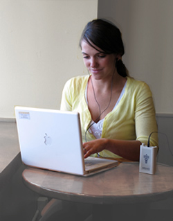Young lady working at a computer and using CES Ultra Young lady working at a computer and using CES Ultra
